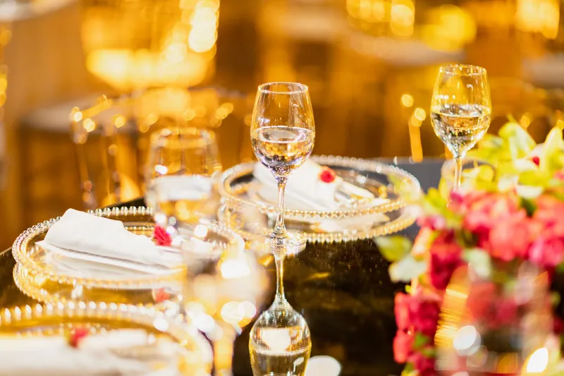Crystal stemware, a beaded charger and a floral table setting