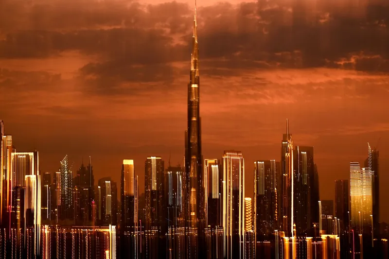 Burj Khalifa and the Dubai skyline at sunset